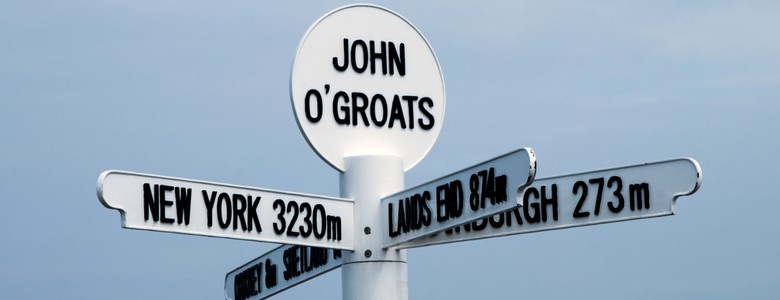 A sign at John O’Groats showing the distance to Land’s End and New York