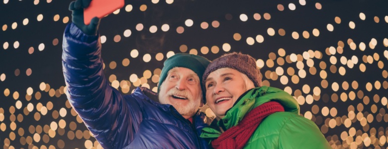 Older couple taking photos of themselves