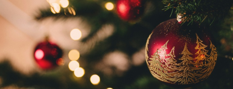 A red bauble on a Christmas tree